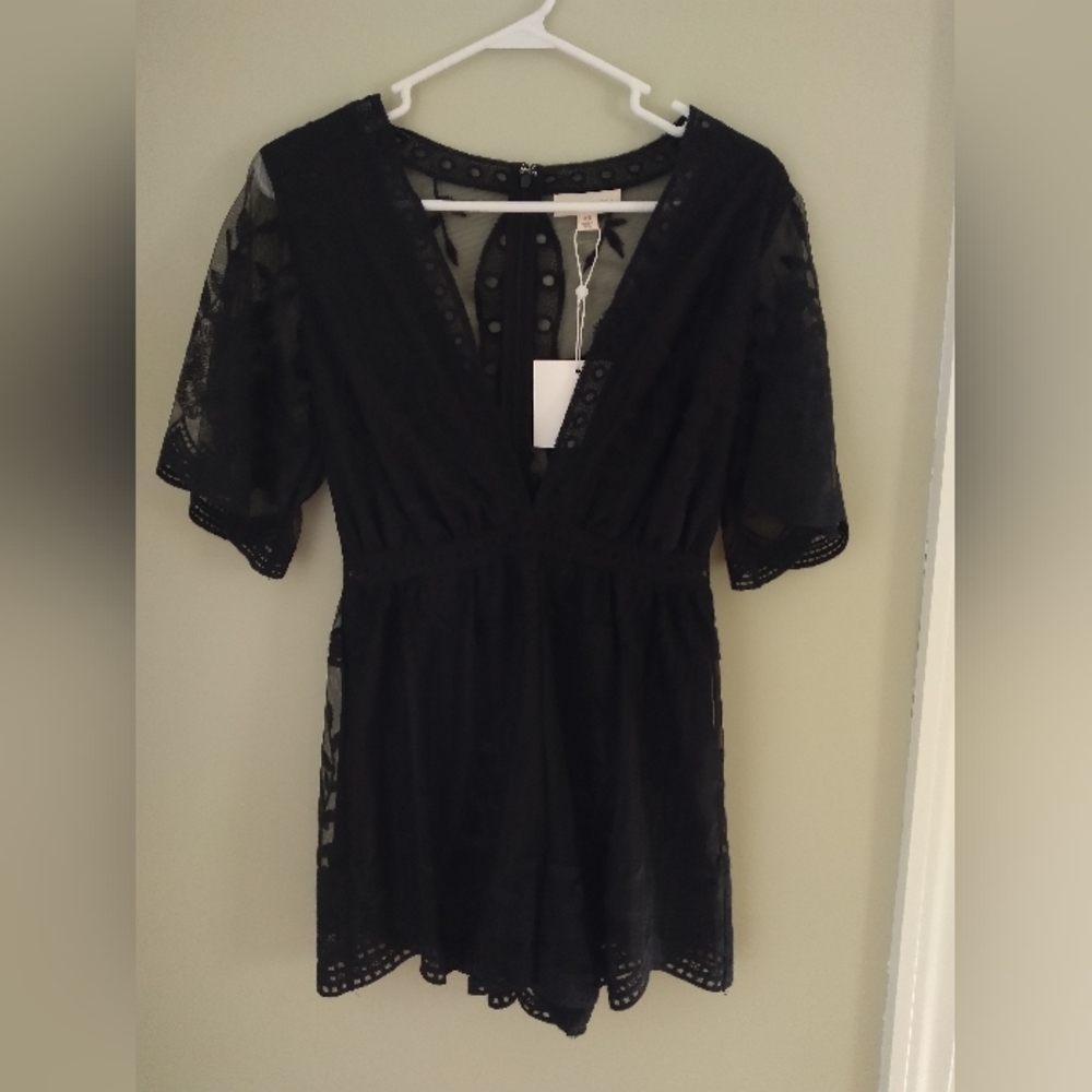 Sheer, black romper